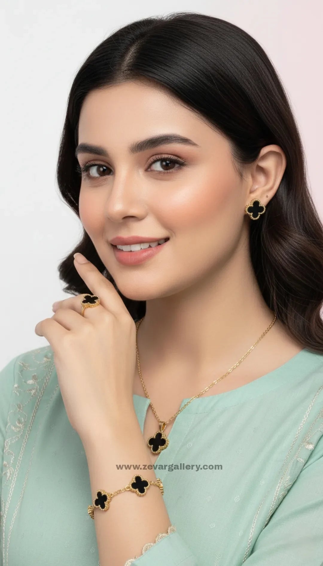 Black clover stainless steel jewelry set with golden outline – necklace, bracelet, earrings, and ring by Zevar Gallery