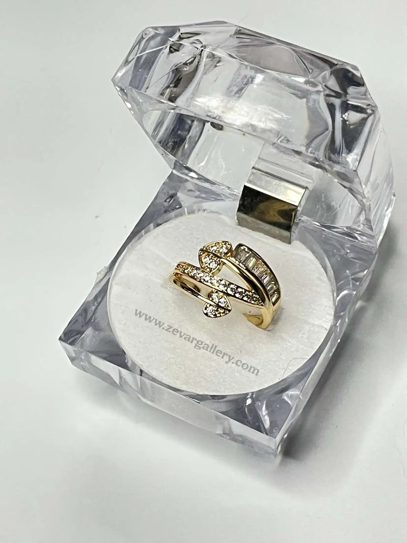 Elegant adjustable wrap ring with baguette and round-cut stones in golden finish – Zevar Gallery