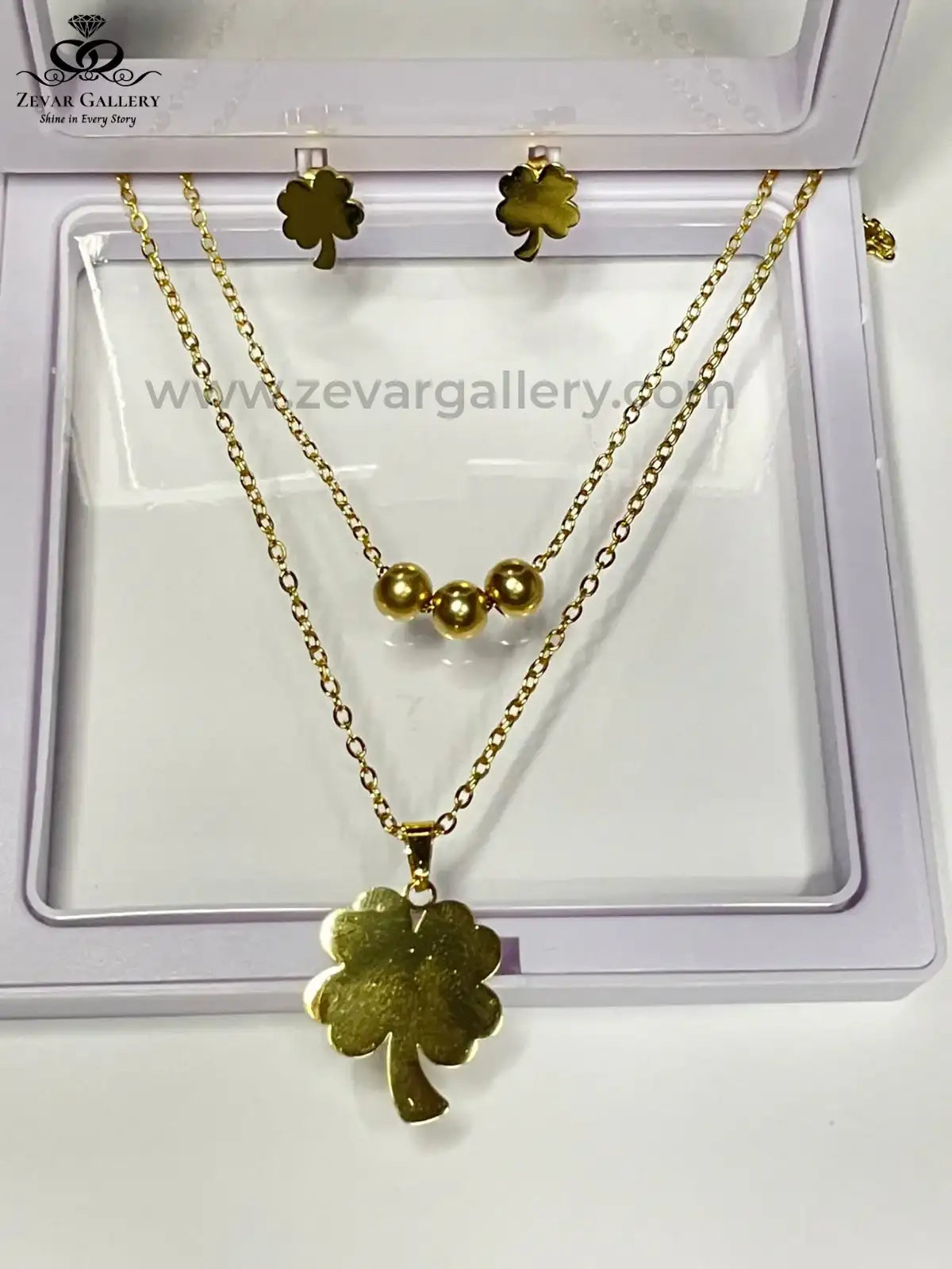 Four Leaf Clover Jewellery Set in Gold Color with necklace and earrings by Zevar Gallery