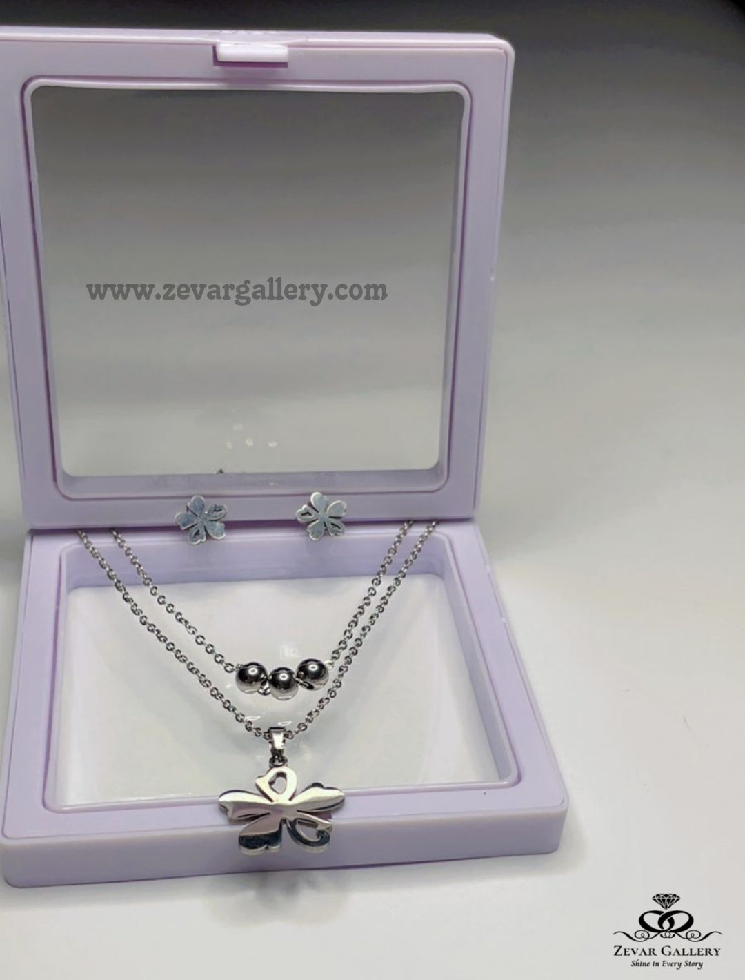 Double layer flower pendant necklace with matching flower stud earrings in silver – Zevar Gallery