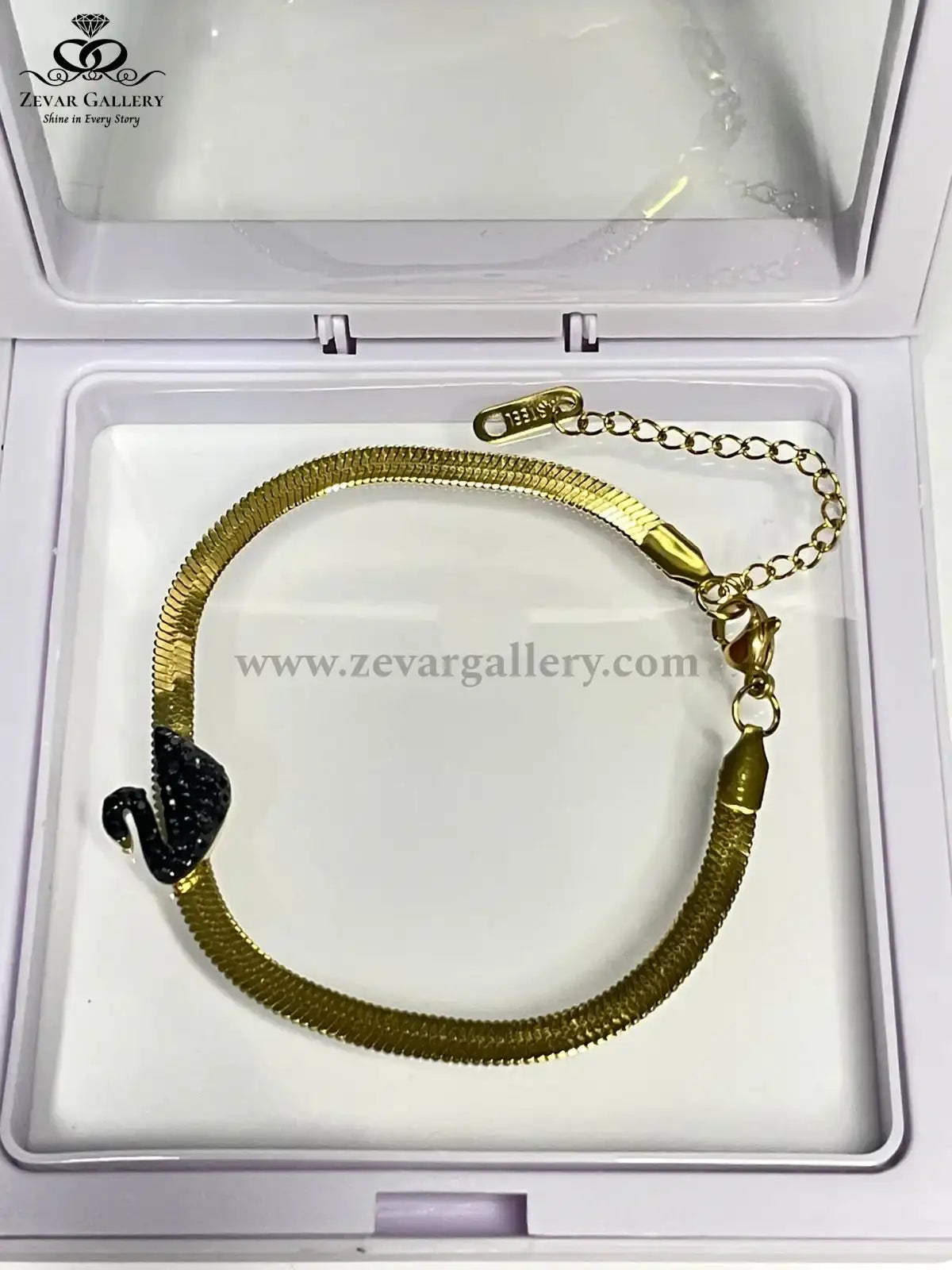 Gold bracelet with black Swan in a Zevar Gallery box
